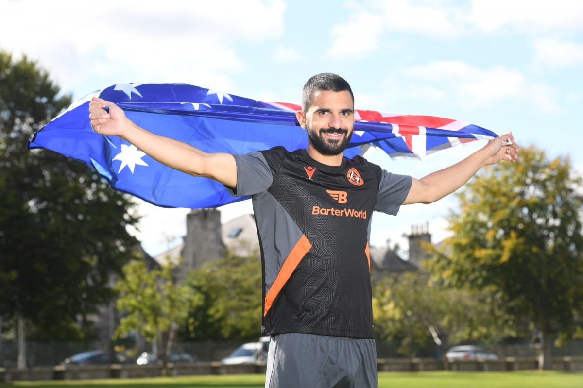 Aziz Behich with Australian flag